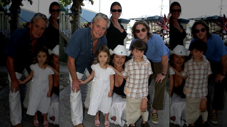 Michael Douglas, Catherine Zeta-Jones and their children pose for a photo at Provo Airport