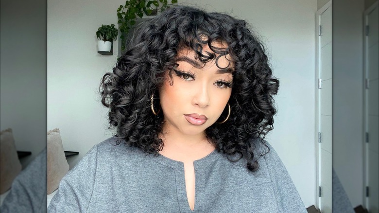 A women with shorter hair and bangs