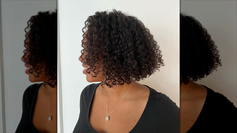 A woman with a curly bob