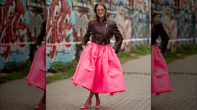 A woman in brown and pink 
