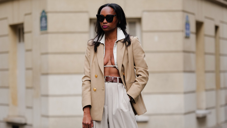 woma in beige coat and outfit