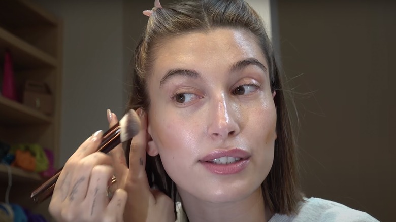 Hailey Bieber in a makeup tutorial 