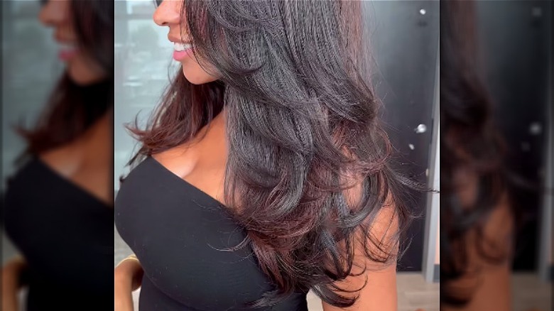 profile of brunette waterfall haircut