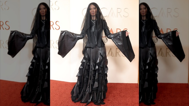 Chloé Zhao in a black veil and dress at the 2026 Oscars