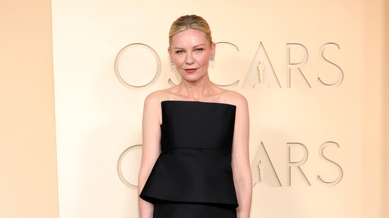 Kirsten Dunst in a black strapless dress at the 2026 Oscars
