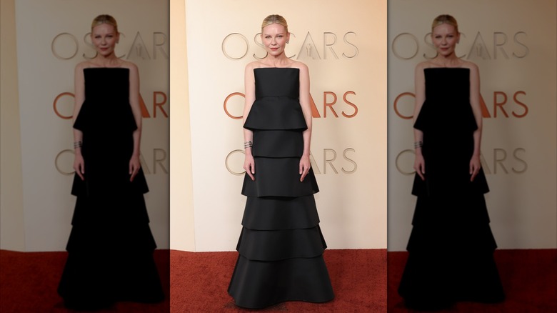 Kirsten Dunst in a black strapless gown at the 2026 Oscars