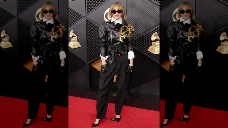 Miley Cyrus at the 2026 Grammy Awards in a black leather jacket and black pants