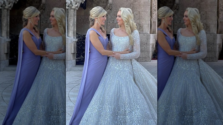 Marla Maples in a purple dress standing next to Tiffany Trump in a wedding gown