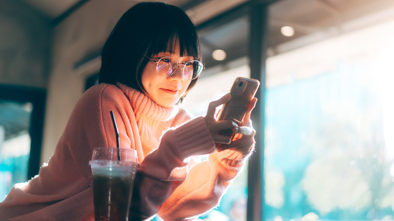 Woman holding phone