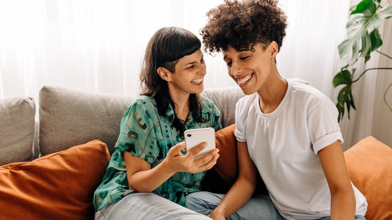 Queer couple smiling