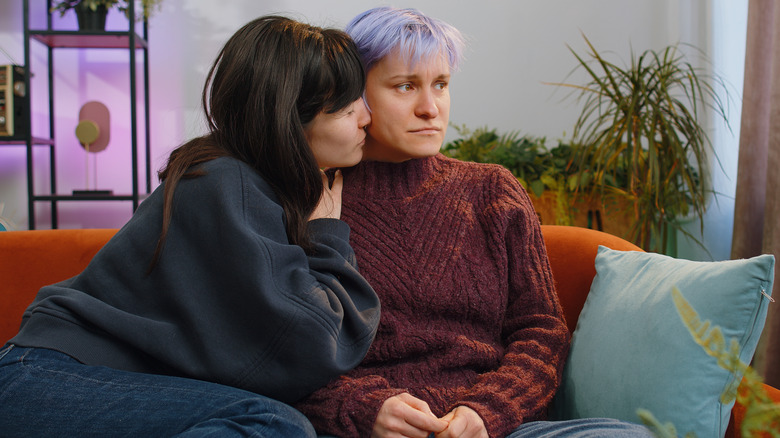 Hugging on couch