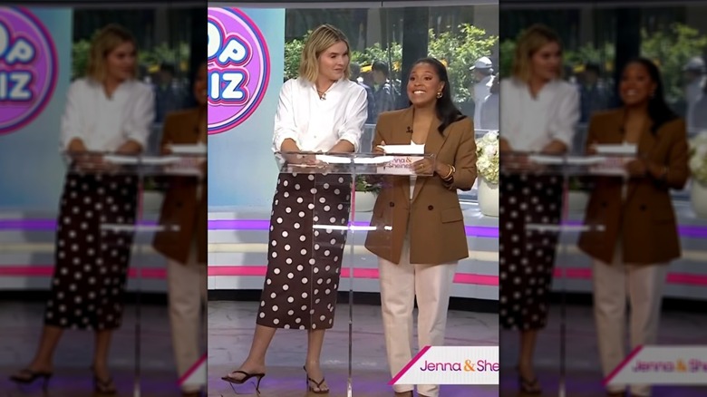 Jenna Bush Hager standing alongside Sheinelle Jones while wearing a polka-dotted skirt and white button-up