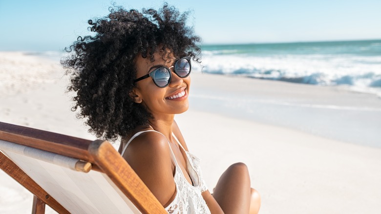 Woman smiling at the beach