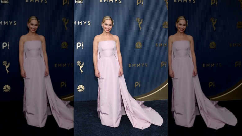 Emilia Clarke on the red carpet in a lilac-colored dress