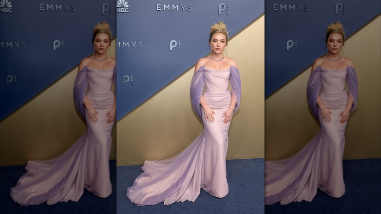 Florence Pugh on the red carpet in a lavender-colored dress