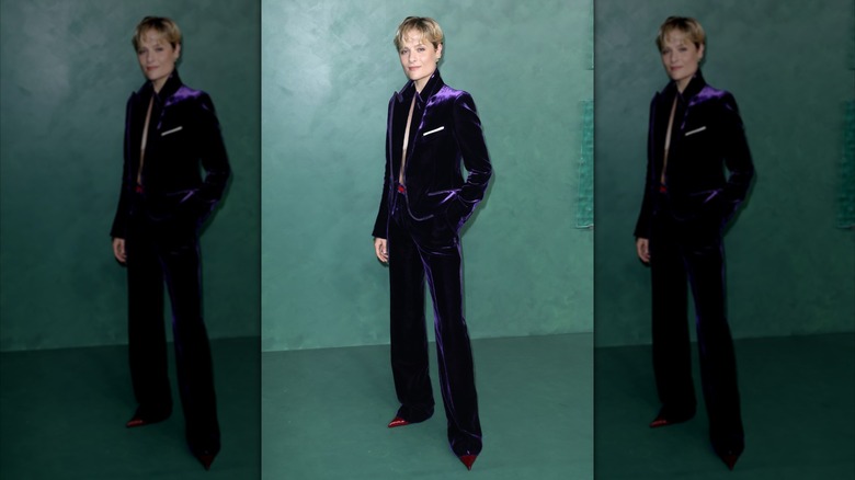 Louisa Jacobson on the red carpet in a purple velvet suit