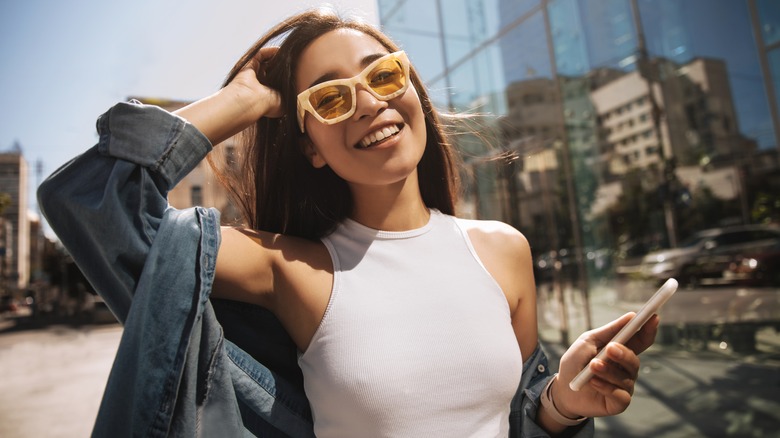 Smiling woman on city street