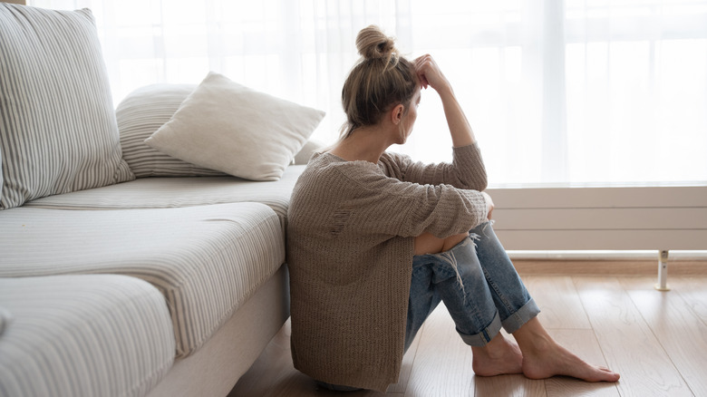 Depressed woman on the floor