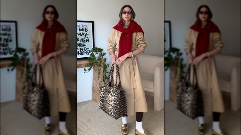 A woman on Instagram in a trench coat and gold loafers