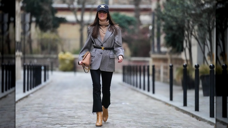 Woman wearing oversized jacket with belt