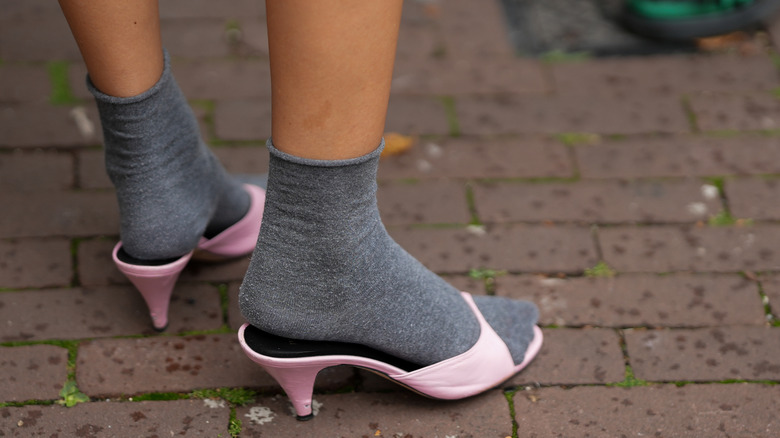 pink mules with grey socks