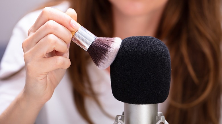 Woman brushes mic ASMR