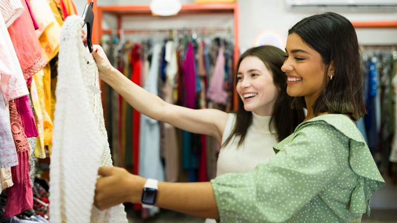 Two women thrift shopping