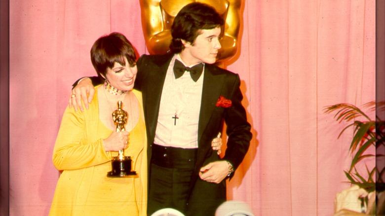 Liza Minnelli posing at the 1973 Oscars alongside Desi Arnaz Jr