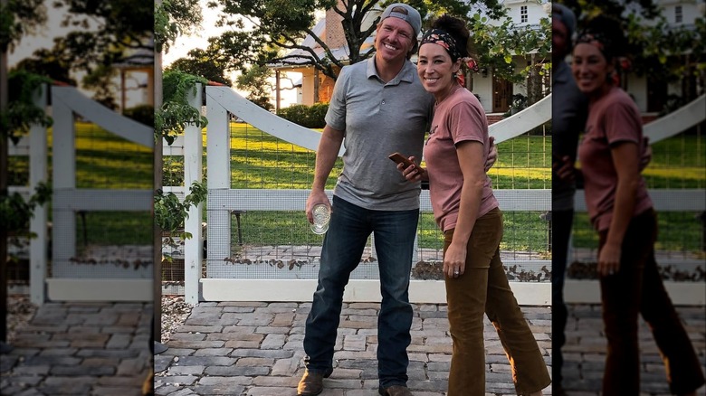 Joanna and Chip Gaines posing for a photo together at home