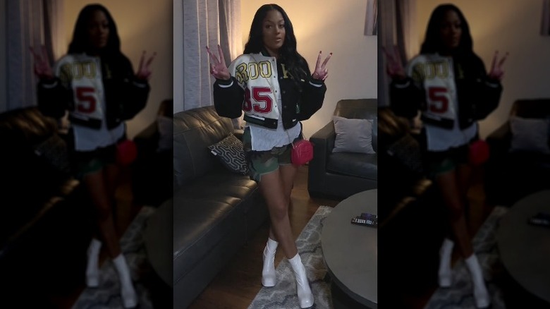 Varsity jacket and camo shorts