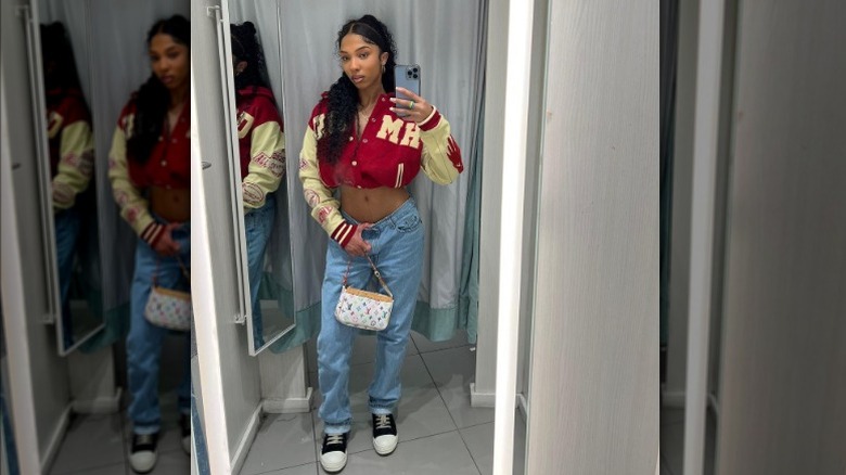 Woman in cropped varsity jacket