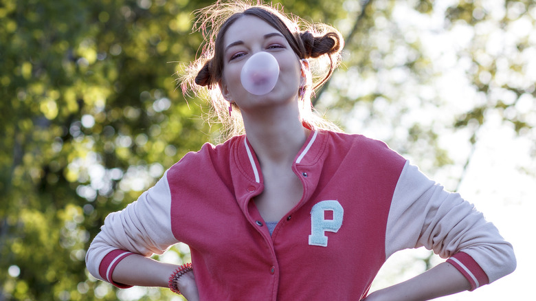 Woman wearing letterman sweater