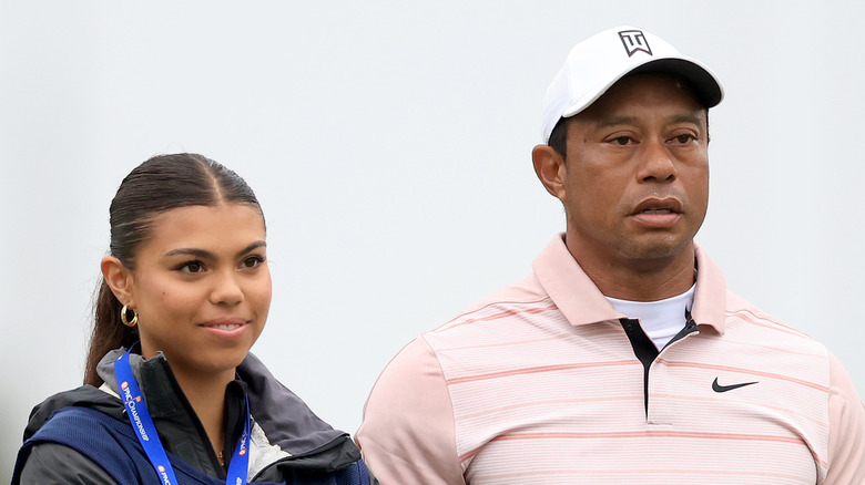 Sam Woods and Tiger Woods standing together