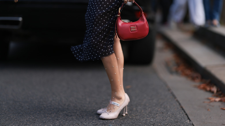 Woman wearing sheer polka-dot tights