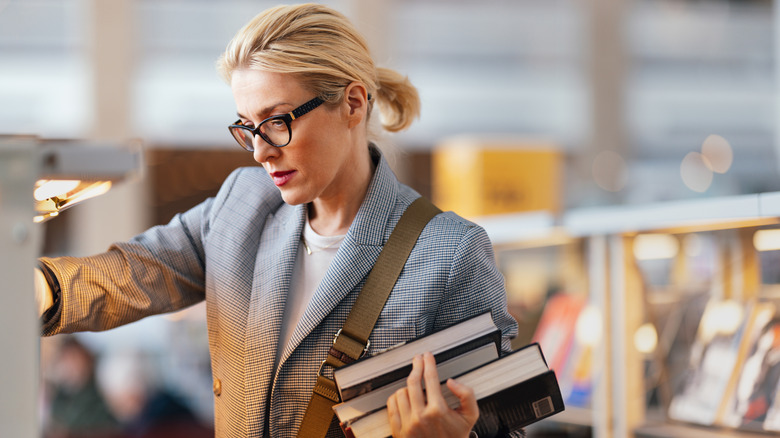 Woman carrying books 
