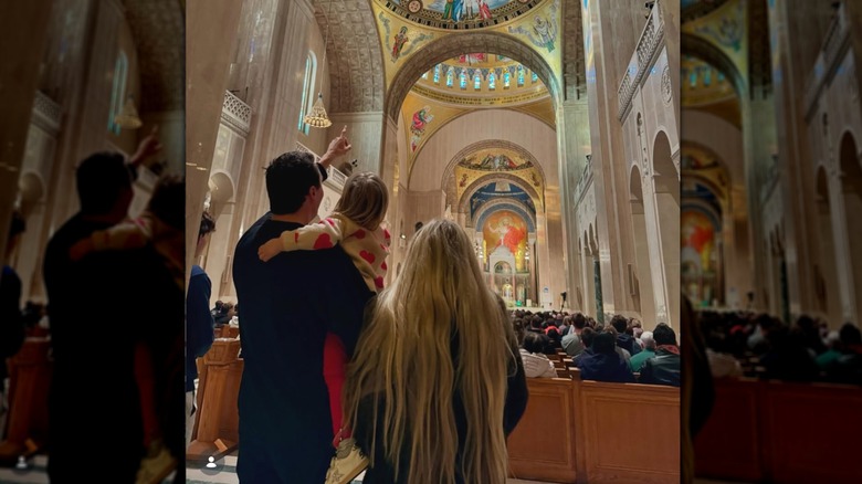 Erika Kirk and her family in a church with their backs to the camera