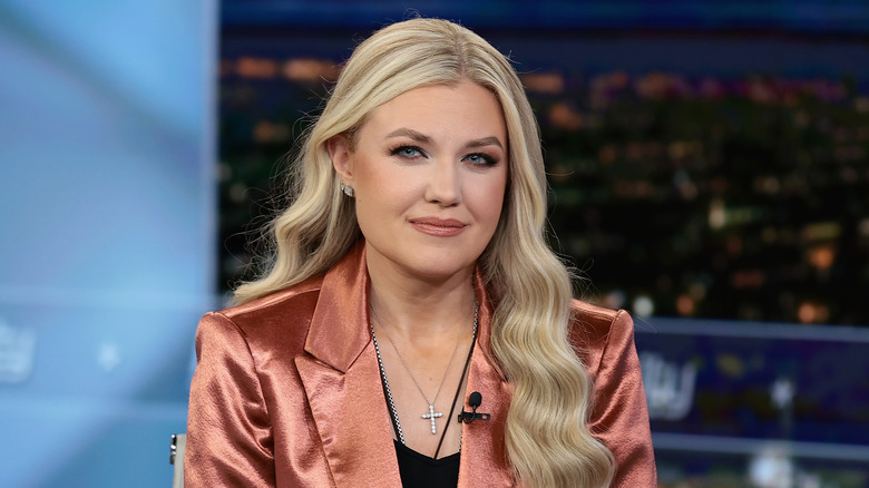 Erika Kirk wearing a pink satin suit