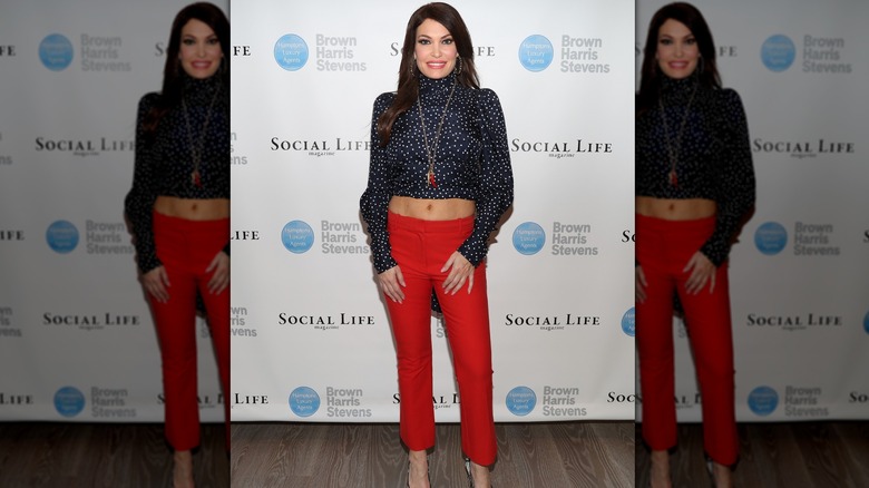 Kimberly Guilfoyle in a polka dot shirt and red pants