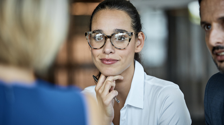 business woman looking at others