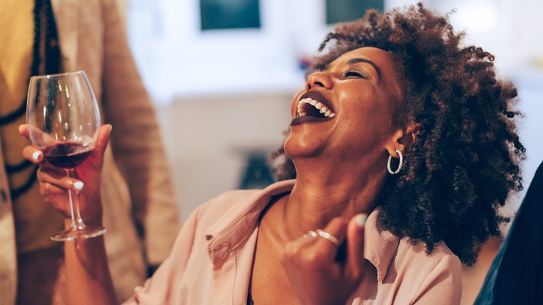 happy woman drinking wine