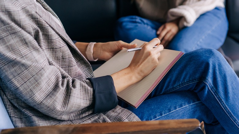 Person writing in a notebook