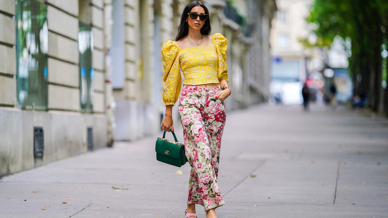 Woman in colorful pants and top 