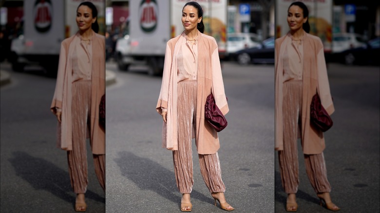 Woman in pink pant suit 