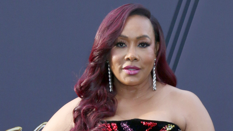 Vivica A. Fox with red hair on a red carpet