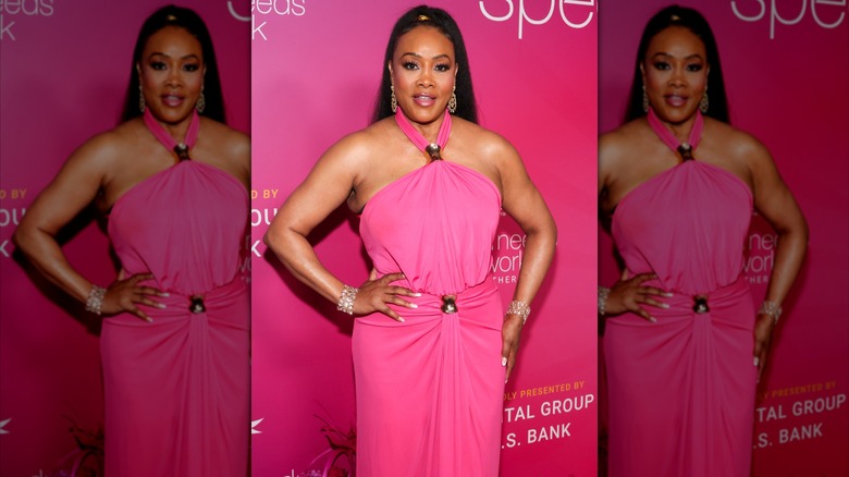 Vivica A. Fox wearing a bright pink dress