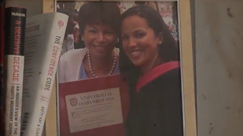 Valerie Jarrett smiling alongside Laura Jarrett on her graduation day