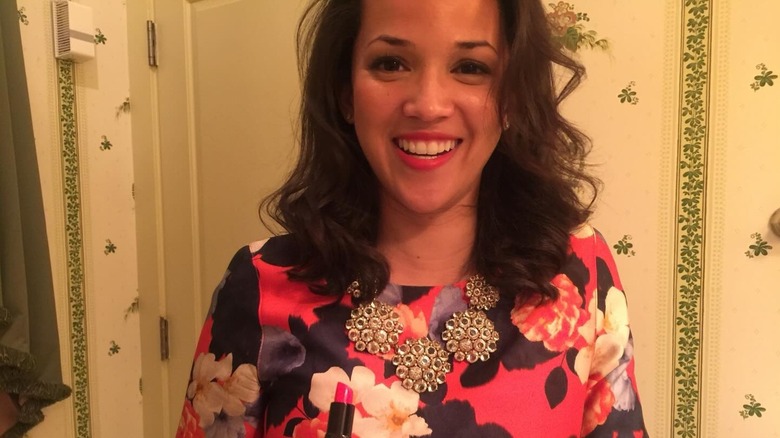 Laura Jarrett smiling wearing a statement necklace in 2016