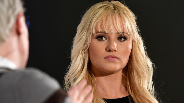 Tomi Lahren looks at the host in the Politicon 2018