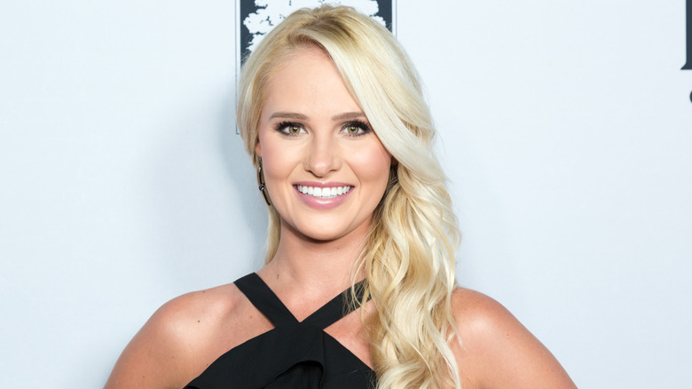 Tomi Lahren smiles on the red carpet in 2018