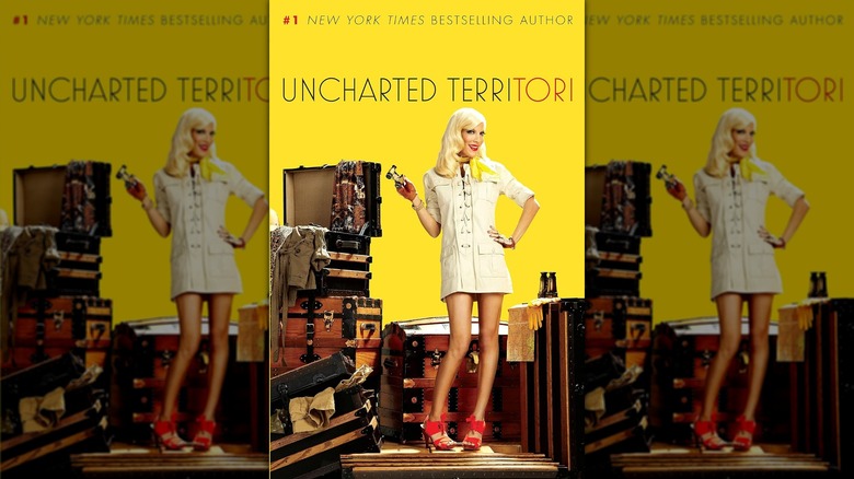 The book cover of "Uncharted TerriTori" by Tori Spelling